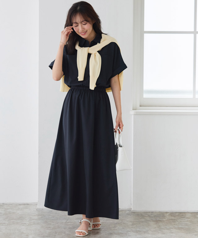 シックなネイビーに春の光を添えて。イエローの肩掛けが映える大人のセットアップ風コーデ